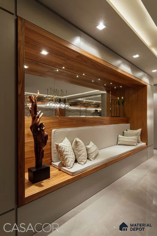A bathroom with a large tub in the middle of the room and two windows overlooking the city at night time area, next to a window filled with lots of the city at night time Space in the background